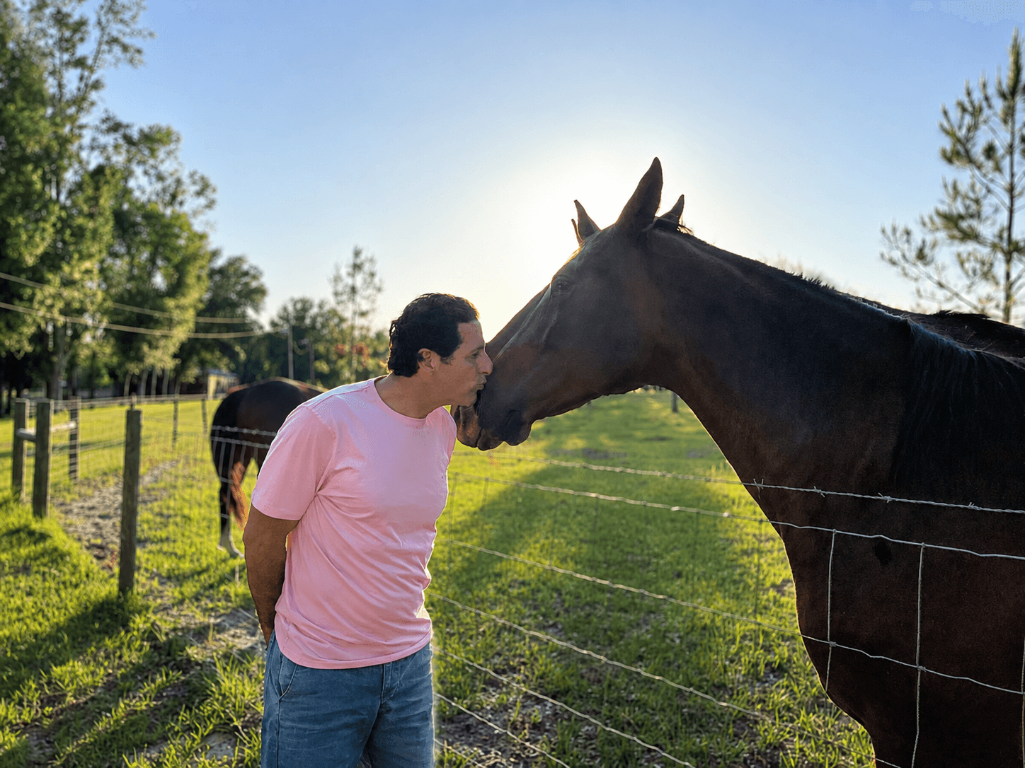 Tom sharing a quiet moment with a horse